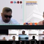 Two speakers in a split-screen video call; left man in sunglasses, right man with glasses, both with event banners in the background.