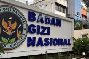 Signboard reading 'Badan Gizi Nasional' with the Indonesian eagle emblem on the left (national nutrition agency).