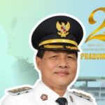 Portrait of a man in a white ceremonial uniform and gold-trimmed peaked cap, outlined in white, with a festive backdrop celebrating Prabumulih's 24th anniversary (2001–2025).